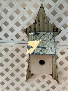 Hanging birdhouse on tin star